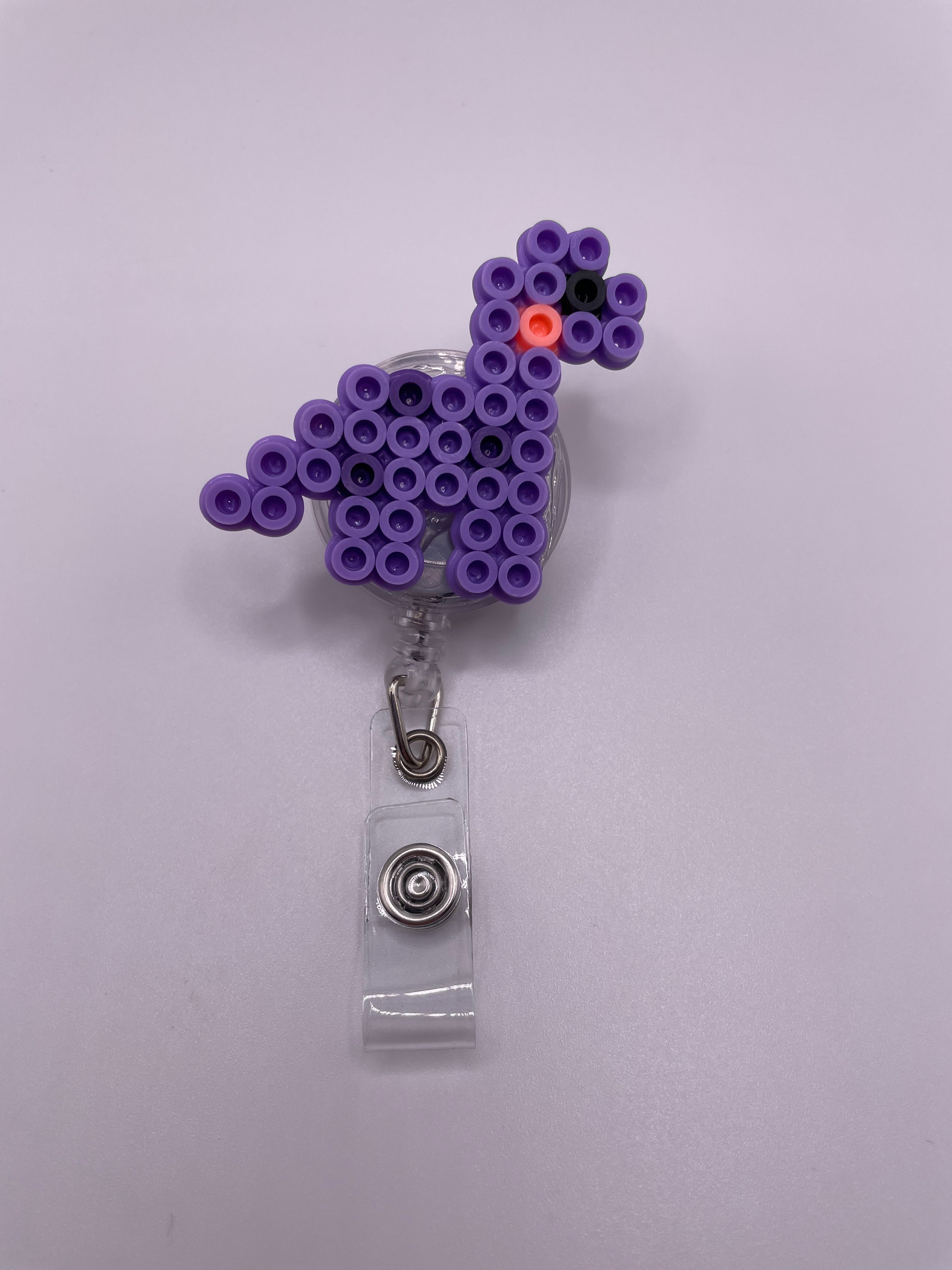 Purple Dino Badge Reel